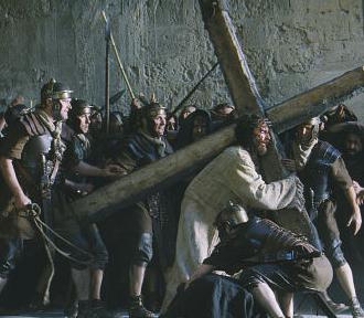 Jesus carries His cross in the Passion of the Christ movie